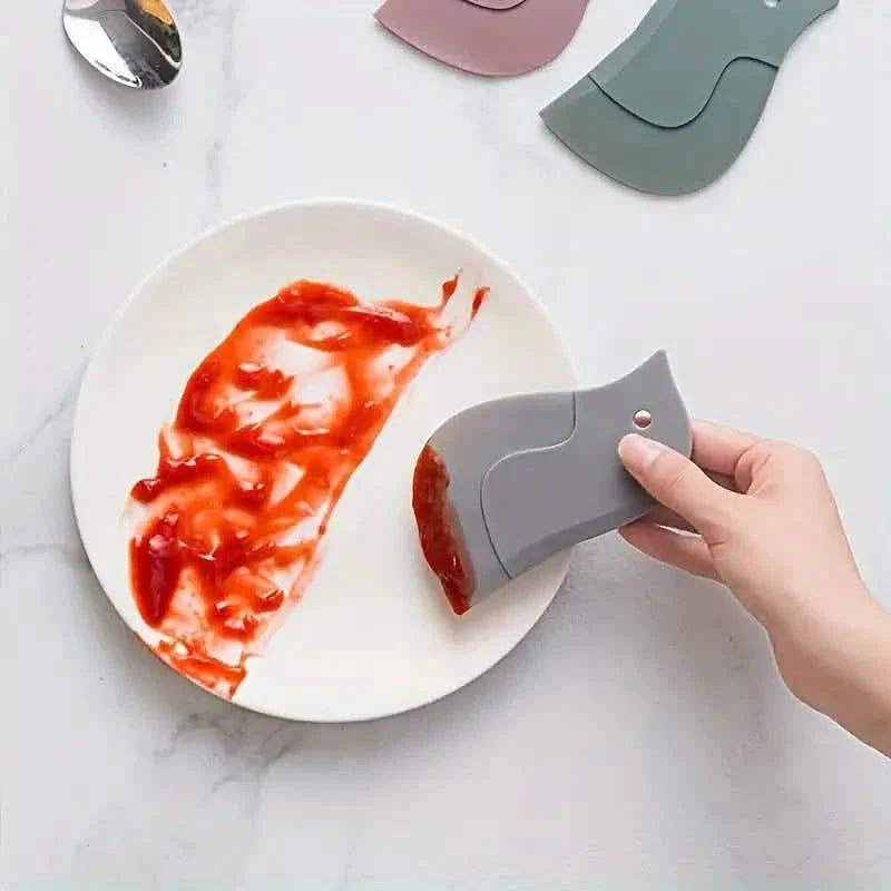 Outil racloir souple de cuisine en forme de pingouin pour enlever les taches