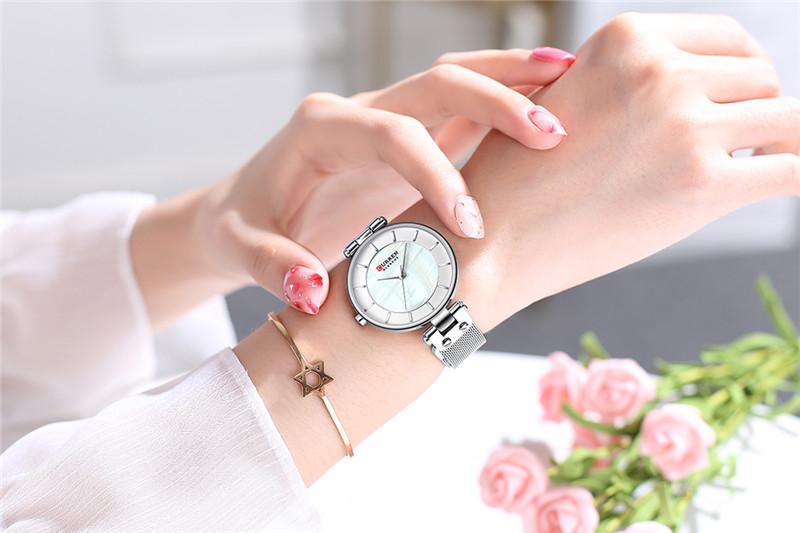 Montres de luxe pour femmes avec un excellent arrière-plan et des designs en zircon, montre-bracelet de style professionnel, cadeau parfait pour elle