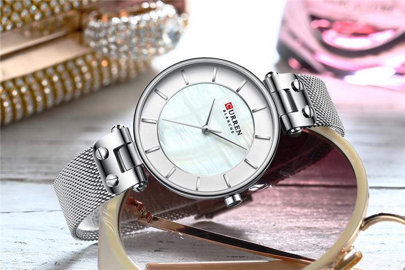 Montres de luxe pour femmes avec un excellent arrière-plan et des designs en zircon, montre-bracelet de style professionnel, cadeau parfait pour elle