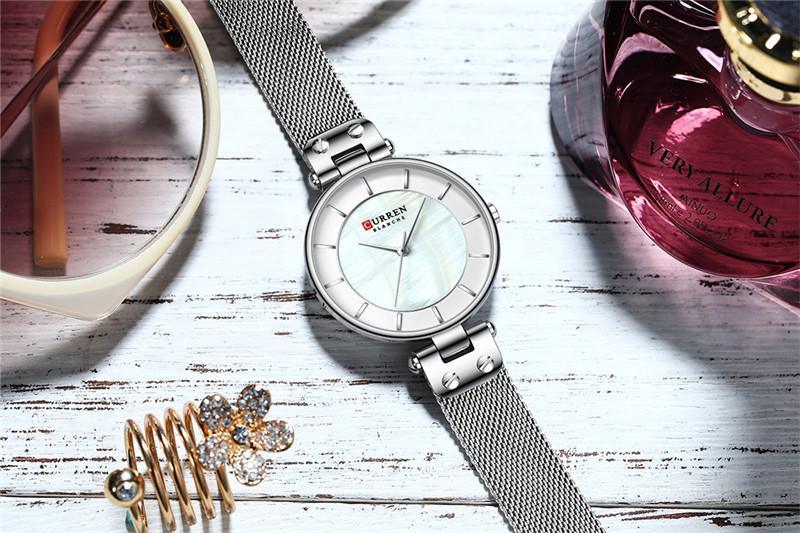 Montres de luxe pour femmes avec un excellent arrière-plan et des designs en zircon, montre-bracelet de style professionnel, cadeau parfait pour elle