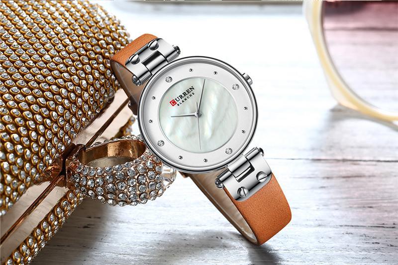 Montres de luxe pour femmes avec un excellent arrière-plan et des designs en zircon, montre-bracelet de style professionnel, cadeau parfait pour elle