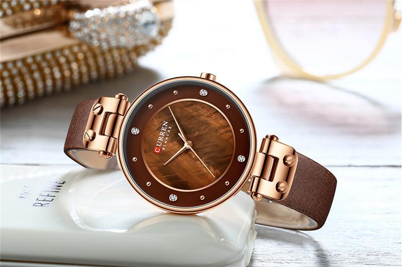 Montres de luxe pour femmes avec un excellent arrière-plan et des designs en zircon, montre-bracelet de style professionnel, cadeau parfait pour elle