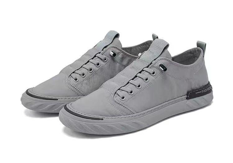 Baskets décontractées en toile pour hommes, confortables et polyvalentes, respirantes, chaussures de sport plates, légères, pour la marche en extérieur, design moderne.