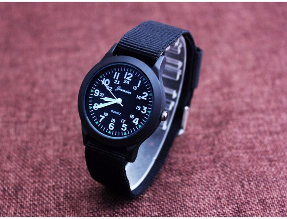 Montre unisexe en nylon pour enfants, style sport, fine, pour étudiants, en toile, à quartz, avec affichage militaire, montre-bracelet de sport militaire pour homme avec bracelet en nylon coulissant.