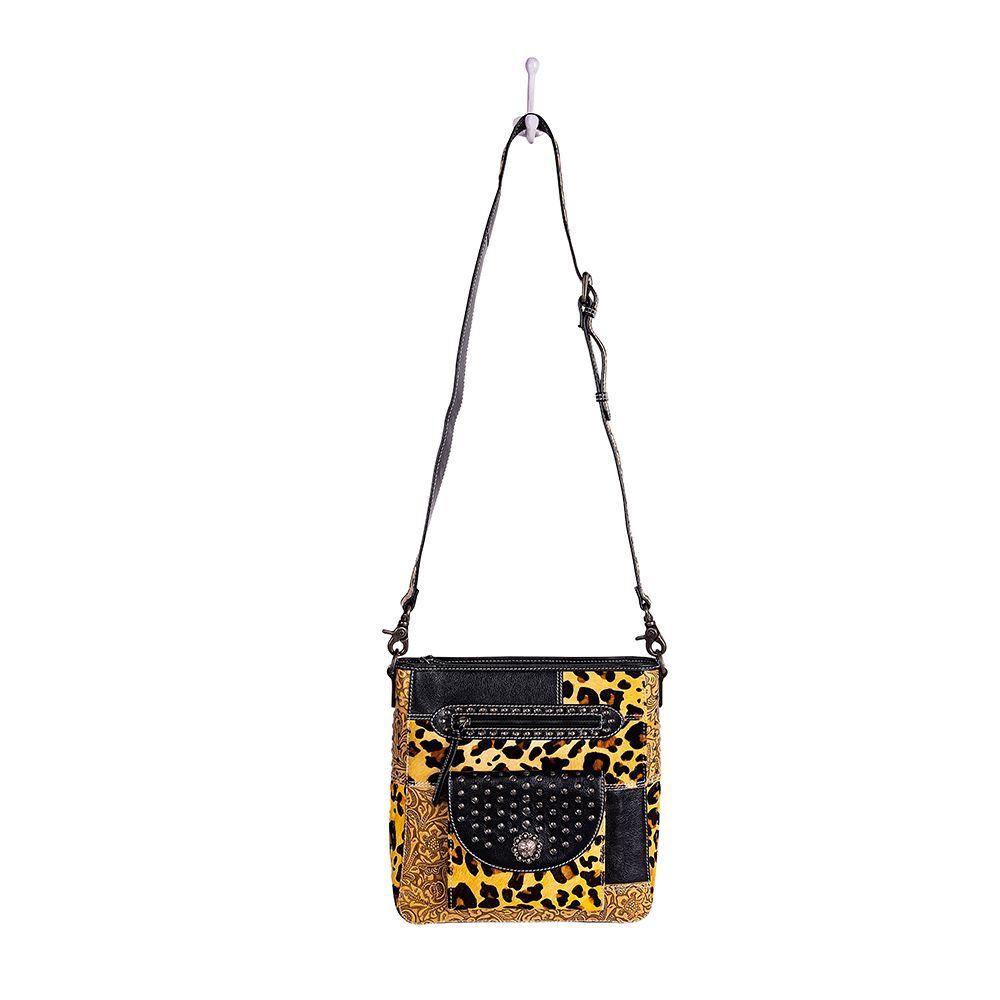 Sac en cuir et poils de veau orné de motifs Jaguar