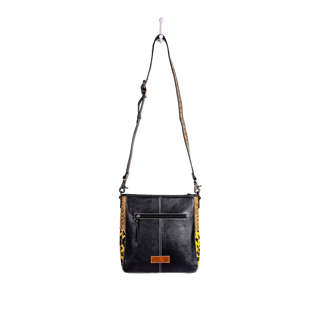 Sac en cuir et poils de veau orné de motifs Jaguar