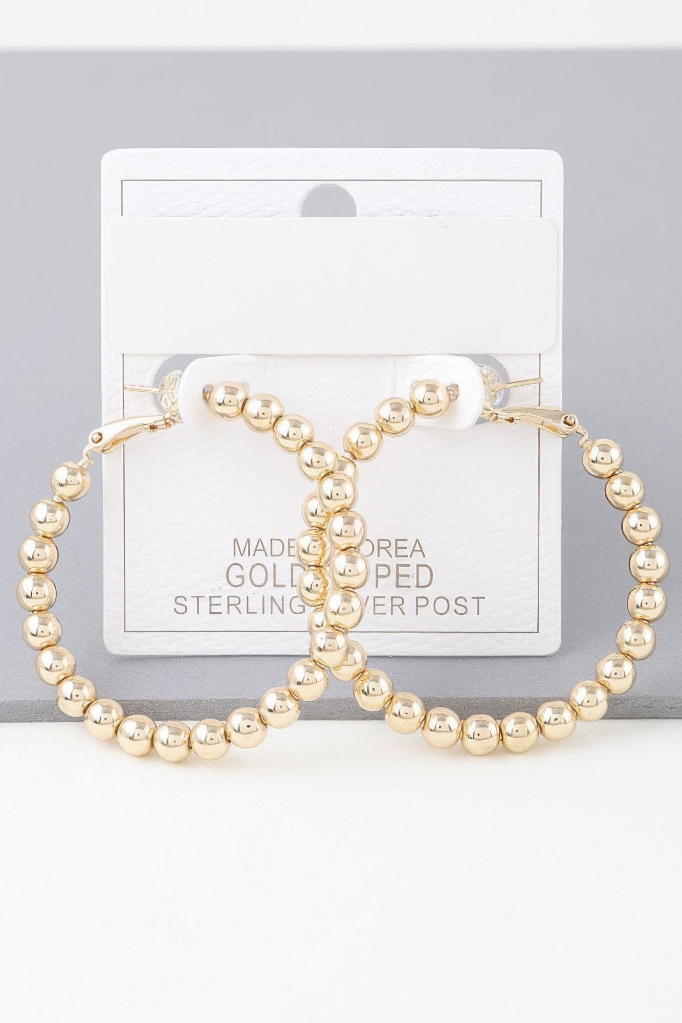 Boucles d'oreilles créoles perlées brillantes