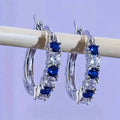 Boucles d'oreilles circulaires hypoallergéniques plaquées argent ornées de pierres synthétiques colorées