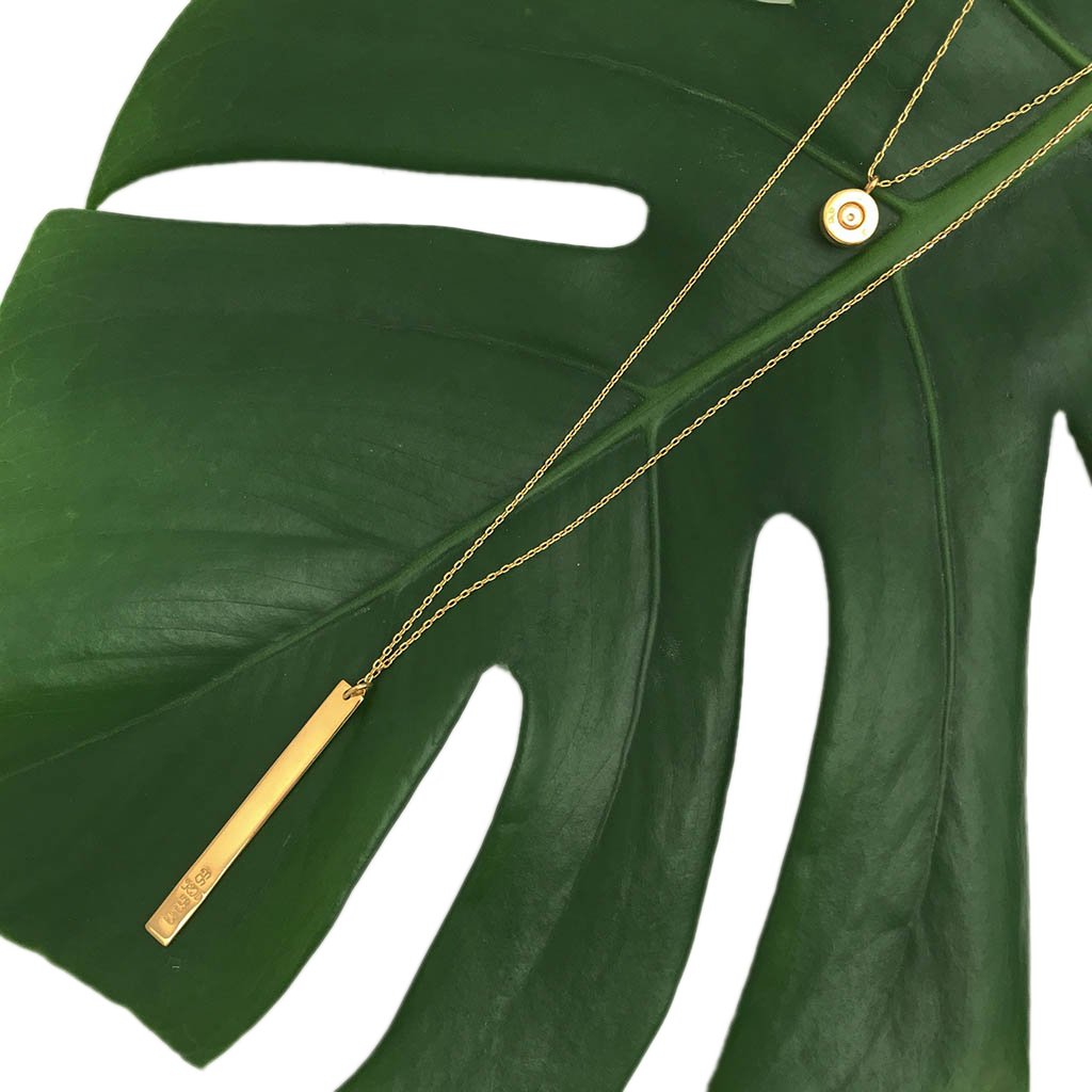 Collier superposé à barre et à balle