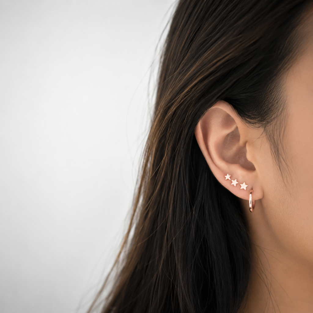 Boucles d'oreilles grimpantes trio d'étoiles en or rose 14 carats laminé