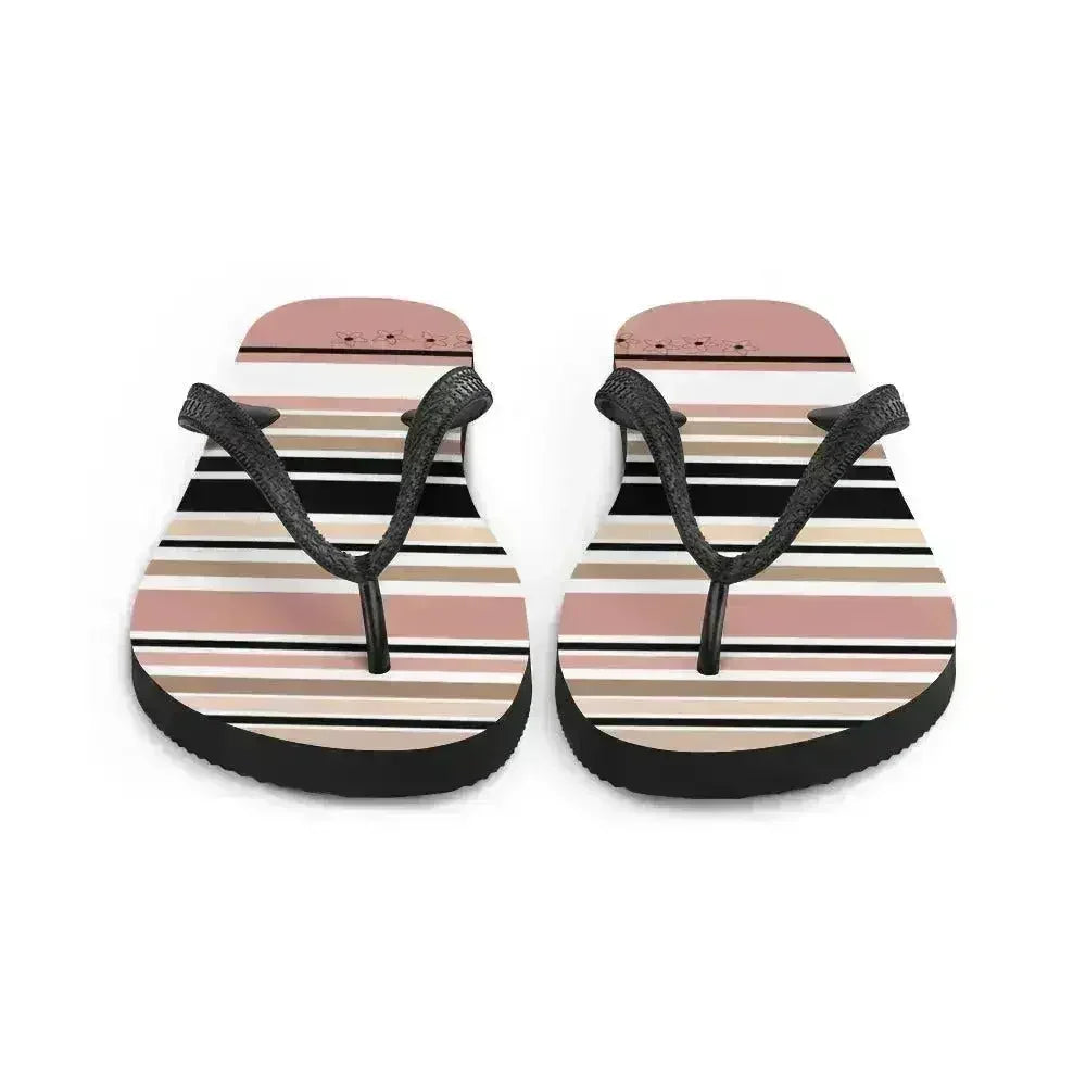 Tongs à rayures beiges, noires et crème avec détail fleur. Chaussures de plage.