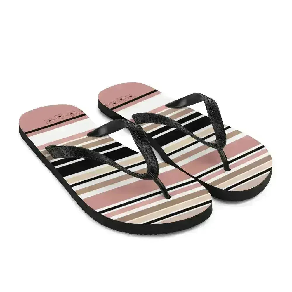 Tongs à rayures beiges, noires et crème avec détail fleur. Chaussures de plage.