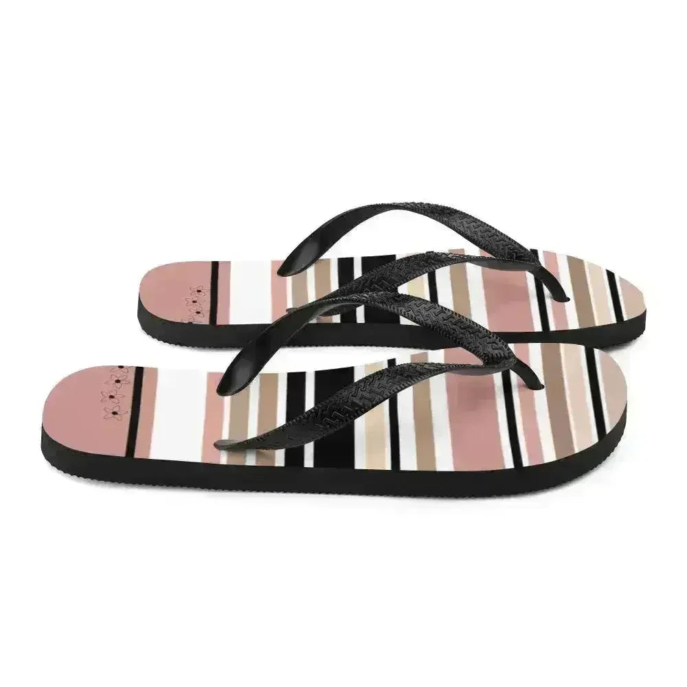 Tongs à rayures beiges, noires et crème avec détail fleur. Chaussures de plage.