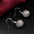 Boucles d'oreilles boule en trois dimensions