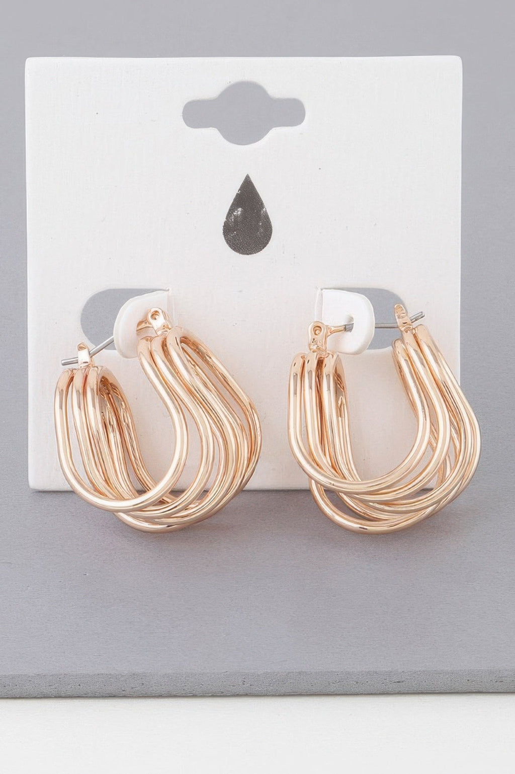 Boucles d'oreilles créoles triple enroulées fil brillant