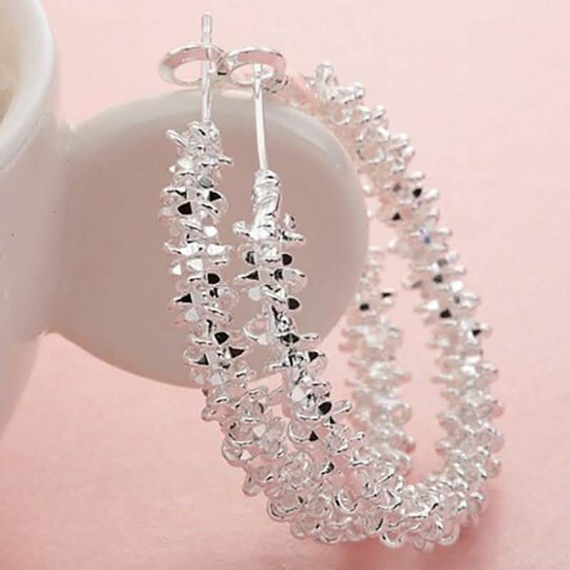 Boucles d'oreilles créoles pendantes Roc en or blanc